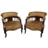A PAIR OF LATE VICTORIAN WALNUT TUB CHAIRS
