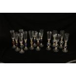 A SET OF FOURTEEN MURANO SALVIATI STYLE DRINKING GLASSES