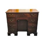 A GEORGIAN MAHOGANY KNEEHOLE DESK