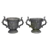 A PAIR OF 19TH CENTURY TWIN HANDLED LEAD PLANTERS