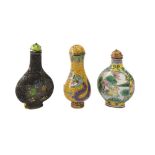 THREE CHINESE ENAMELLED METAL SNUFF BOTTLES.