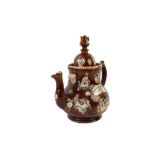 A VICTORIAN TREACLE GLAZED BARGEWARE TEAPOT