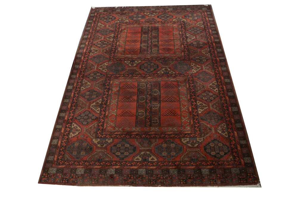 A MACHINE MADE RUG OF CLASSIC YOMUT DESIGN
