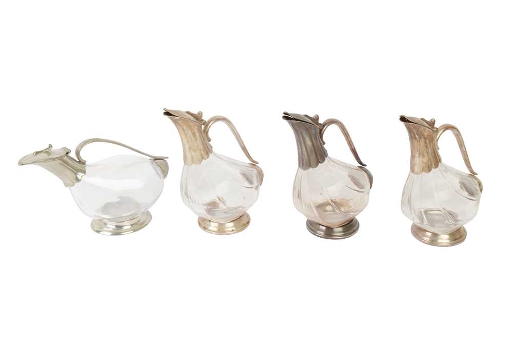 A SET OF THREE ZWIESEL SILVER PLATED AND GLASS DECANTERS