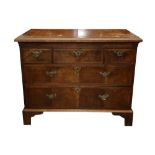 A GEORGE II AND LATER WALNUT AND OAK CHEST OF DRAWERS