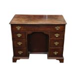 A GEORGIAN MAHOGANY KNEEHOLE DESK