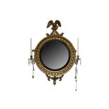 A REGENCY GILT CONVEX WALL MIRROR