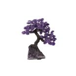 AN AMETHYST GEODE AND AMETHYST CHIP MODEL OF A TREE IN BLOSSOM