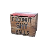 A BOX OF NINE ORIGINAL FAIRGROUND COCONUT SHY BALLS