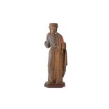 A 16TH CENTURY CARVED WOOD AND POLYCHROME DECORATED FIGURE OF A SAINT