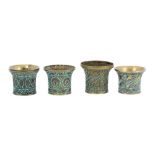 FOUR GLASS BEAD AND TURQUOISE-SET BRASS QALYAN CUPS Qajar Iran, 19th century