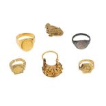 A COLLECTION OF SMALL GOLD JEWELLERY ELEMENTS AND A SILVER RING Iran, Anatolia and Egypt, 10th - 15t