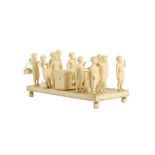 λ A CARVED IVORY FIGURAL PALANQUIN VILLAGE SCENE Delhi, Northern India, 19th century