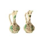 A NEAR PAIR OF GREEN-SPLASHED WHITE-GLAZED CANAKKALE POTTERY EWERS Ottoman Turkey, 19th century