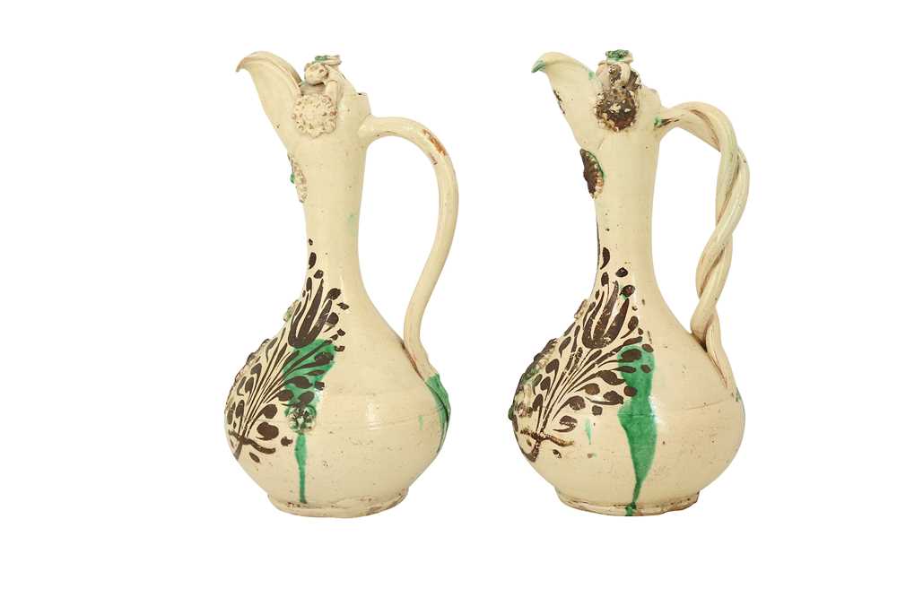 A NEAR PAIR OF GREEN-SPLASHED WHITE-GLAZED CANAKKALE POTTERY EWERS Ottoman Turkey, 19th century - Image 4 of 6