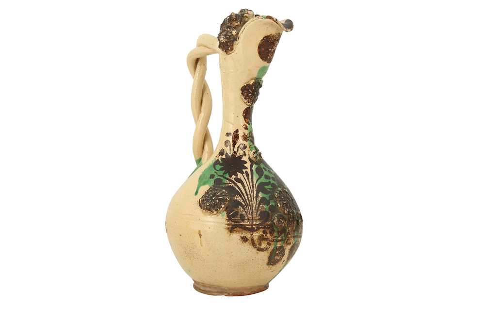 A LARGE GREEN-SPLASHED WHITE-GLAZED CANAKKALE POTTERY EWER Ottoman Turkey, 19th century