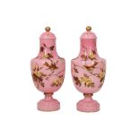 A PAIR OF BACCARAT-STYLE PINK AND WHITE OPALINE GLASS LIDDED VASES PAINTED WITH GOL-O-BOLBOL MOTIF F