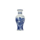 A CHINESE BLUE AND WHITE 'QILIN ON ROCKS' BALUSTER VASE.
