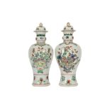 A NEAR-PAIR OF CHINESE FAMILLE VERTE BALUSTER VASES AND COVERS.