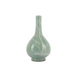 A LARGE CHINESE SLIP-DECORATED CELADON PEAR-SHAPED VASE.