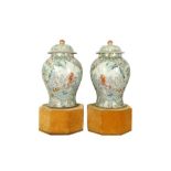 A PAIR OF FAMILLE ROSE MILLEFLEUR VASES AND COVERS.