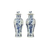 A PAIR OF CHINESE BLUE AND WHITE HEXAGONAL BALUSTER VASES AND COVERS.