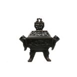 A BRONZE 'MARRIAGE' INCENSE BURNER AND COVER.