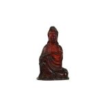 A CHINESE RECOMPOSITED AMBER FIGURE OF GUANYIN.