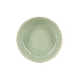 A CHINESE INCISED CELADON 'DRAGONS' DISH.