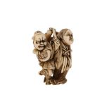 λ AN IVORY NETSUKE OF KAGURA DANCERS.