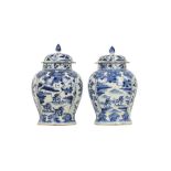 A PAIR OF CHINESE BLUE AND WHITE BALUSTER VASES AND COVERS.