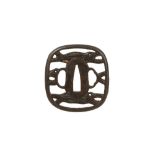 AN IRON SUKASHI TSUBA.