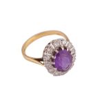 AN AMETHYST AND DIAMOND CLUSTER RING