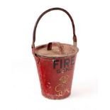 A red fire bucket with lid, marked 'Fire' with a crown and the initials 'GR VI', 23.
