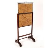 A mid 19th Century rosewood fire screen with adjustable needlework panel,