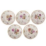 A set of sixteen Nymphenburg plates, circa 1900, printed and painted with flower bouquets,