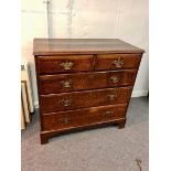 A George III oak chest of two short and three long drawers, on bracket feet,