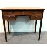 A George III mahogany kneehole dressing table, fitted an arrangement of four drawers,