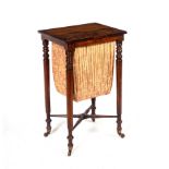 A mid 19th Century rosewood work table with pleated basket beneath,