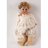 A Simon & Halbig 39, for Kammer Reinhart bisque head doll with sleepy eyes, open mouth with teeth,