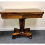 A Victorian rosewood fold-over card table on hexagonal column and platform base, 91.