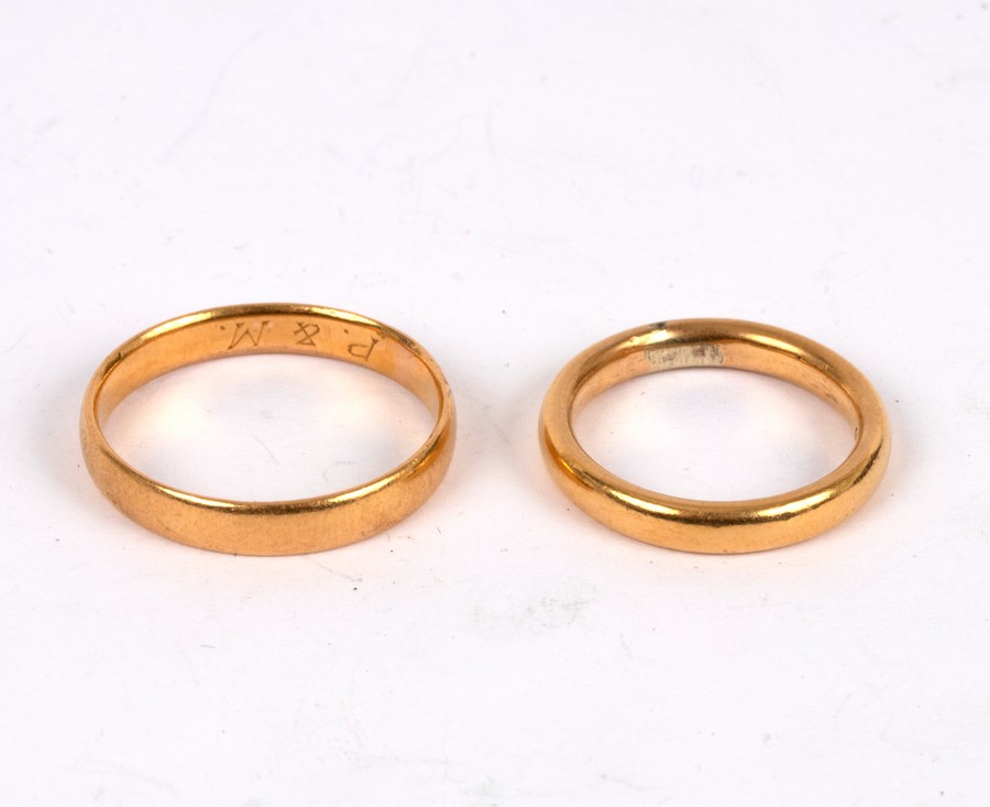 Two 22ct gold wedding bands, sizes U and M½,
