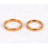 Two 22ct gold wedding bands, sizes U and M½,