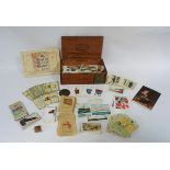 A quantity of cigarette cards including J Wicks & Sons Ltd.