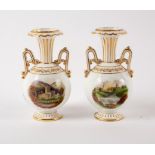 A pair of English porcelain two-handled topographical vases in white and gilt,