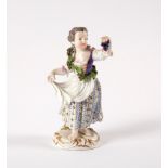 A Meissen figure of a girl with grapes,