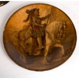 A papier-mâché charger decorated a knight on horseback,