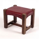 A Liberty oak stool on square legs untied by an H stretcher bearing ivorine Liberty label,