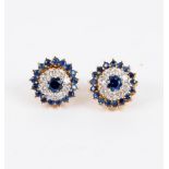 A pair of sapphire and diamond cluster ear studs with detachable outer border of sapphires,