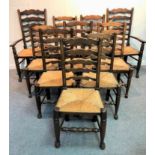 A set of ten ash and elm ladder back dining chairs with rush seats,